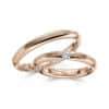 Trauringe mit Perlfuge und Brillant in Spannfassung Rotgold